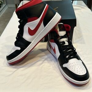 The Air Jordan 1 Mid Gym white/black with red swoosh